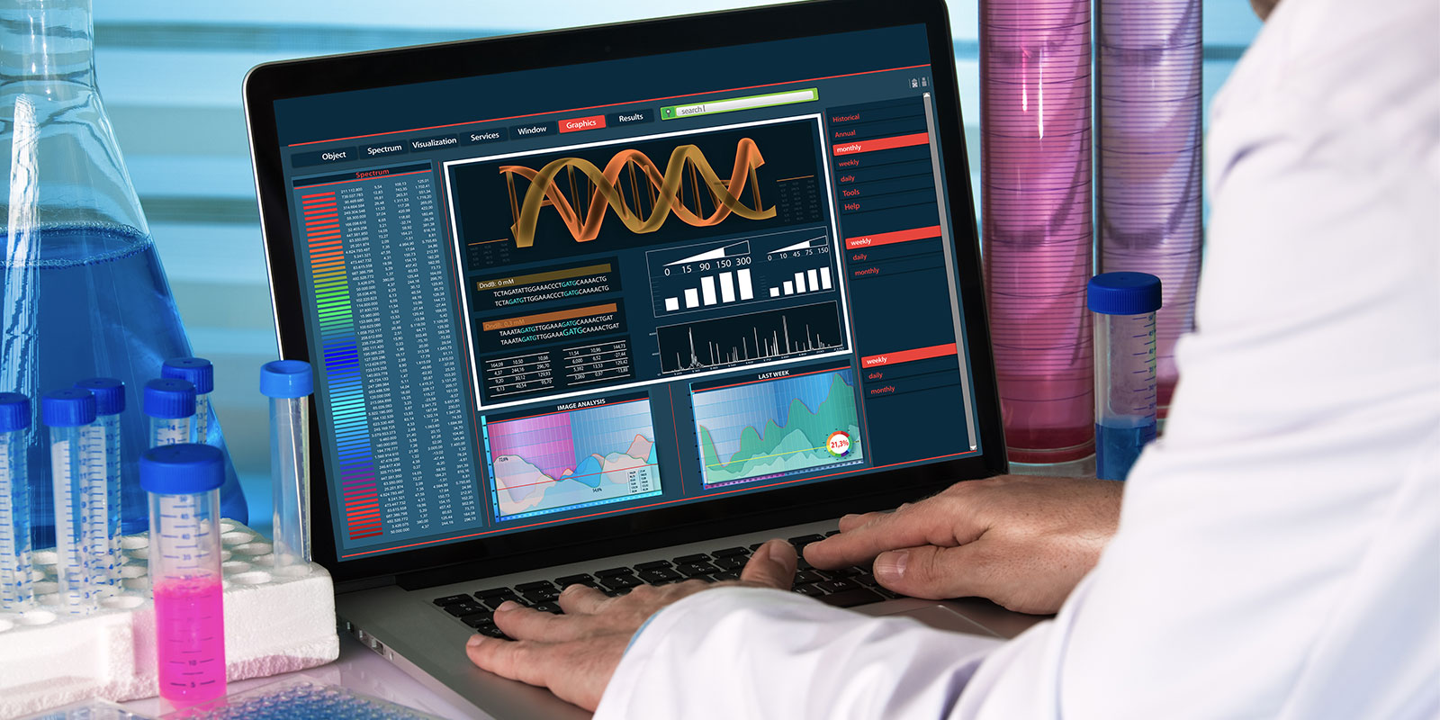 genetic engineer working with analysis dna software on laptop in the genetic laboratory